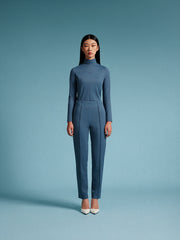 model wear blue turtle neck top and blue pants