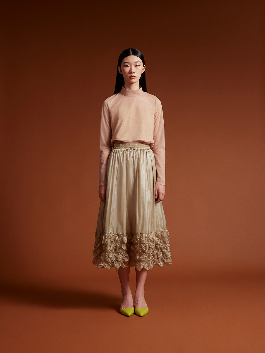 model wear Beige see through top long sleeve