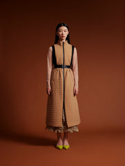 model wear long vest coat