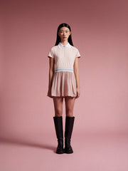 model wear pink tennis dress